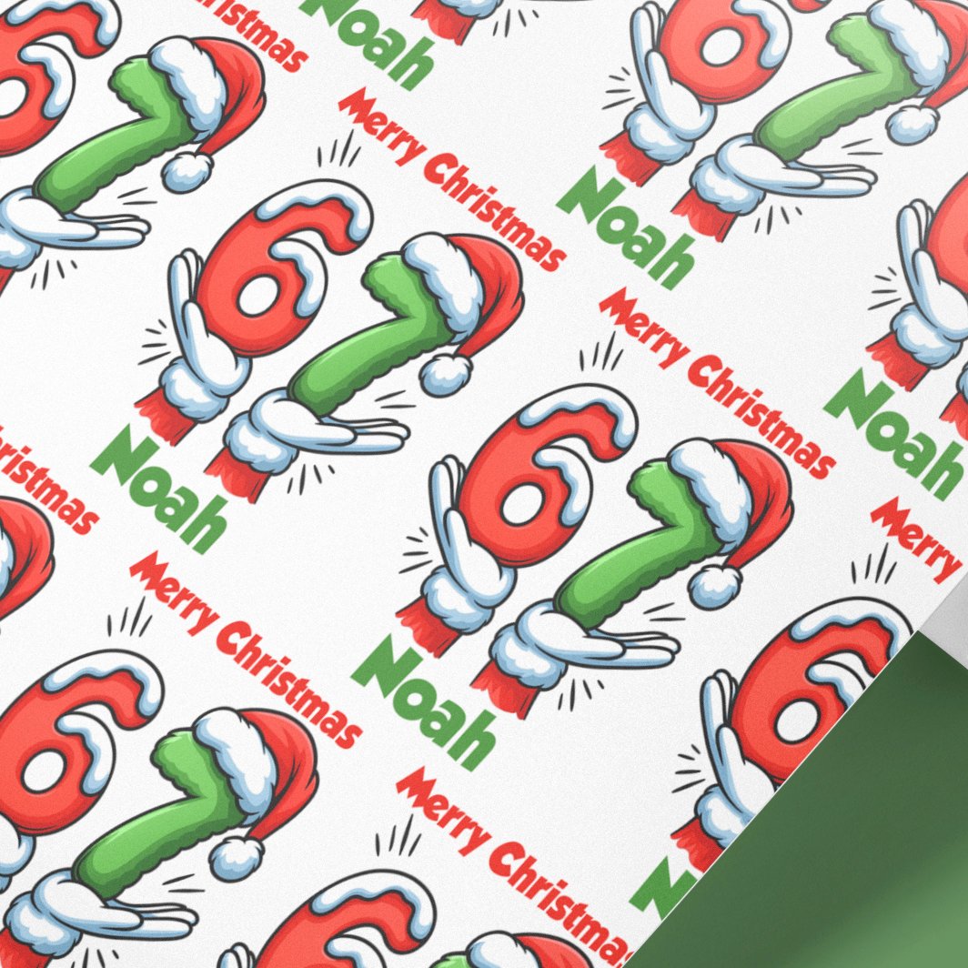 Personalised 67 meme Christmas wrapping paper roll with custom name Noah printed on 100gsm matte paper, festive Santa hat design.